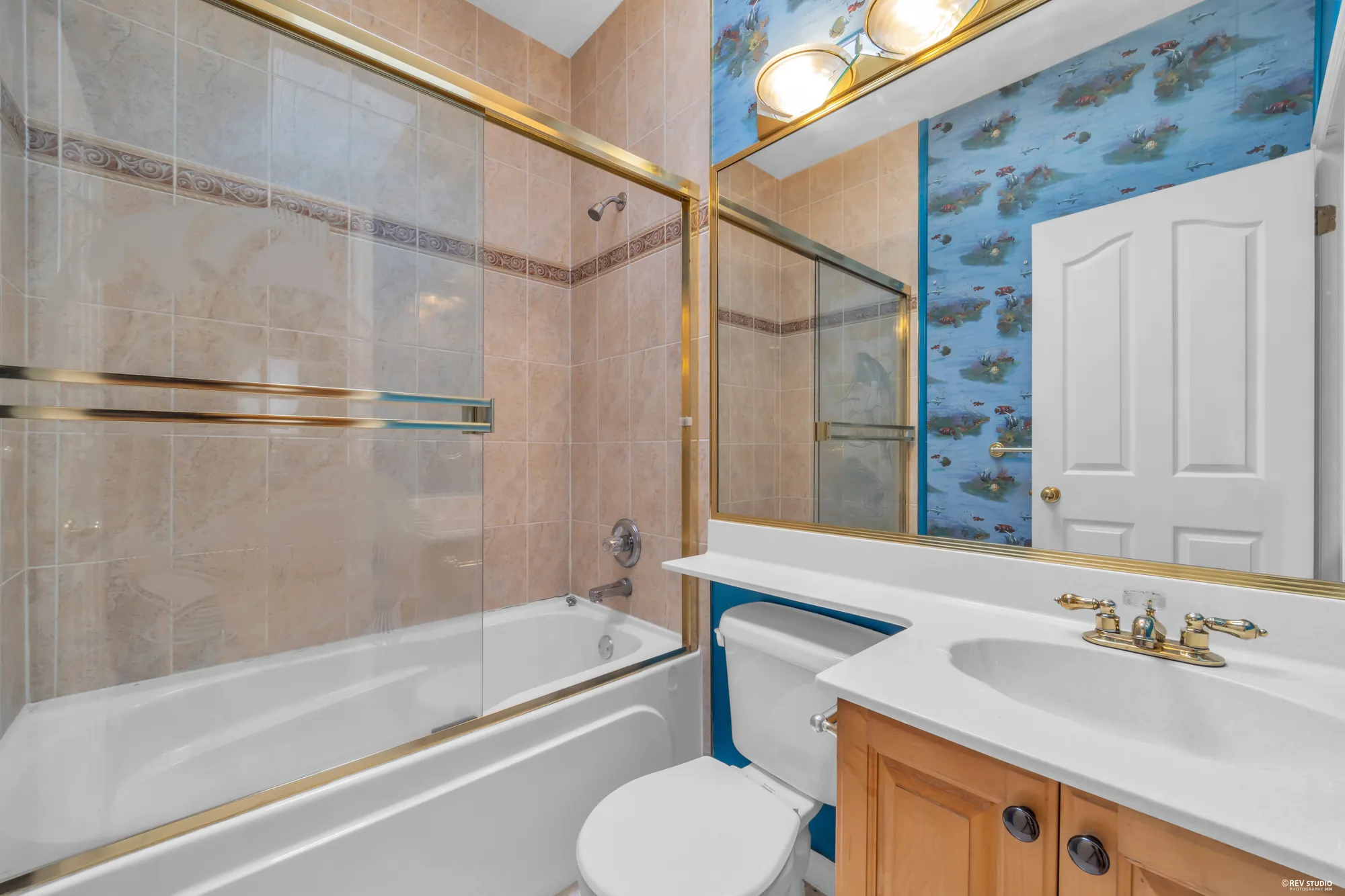 The upstairs bathroom from the other side, with the vanity and mirror