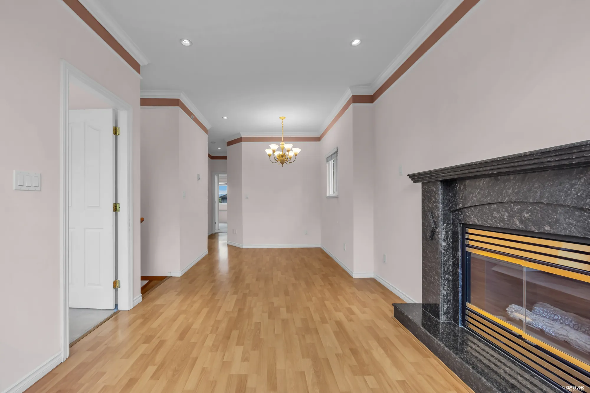 Looking down the hall past the fireplace toward the bedrooms