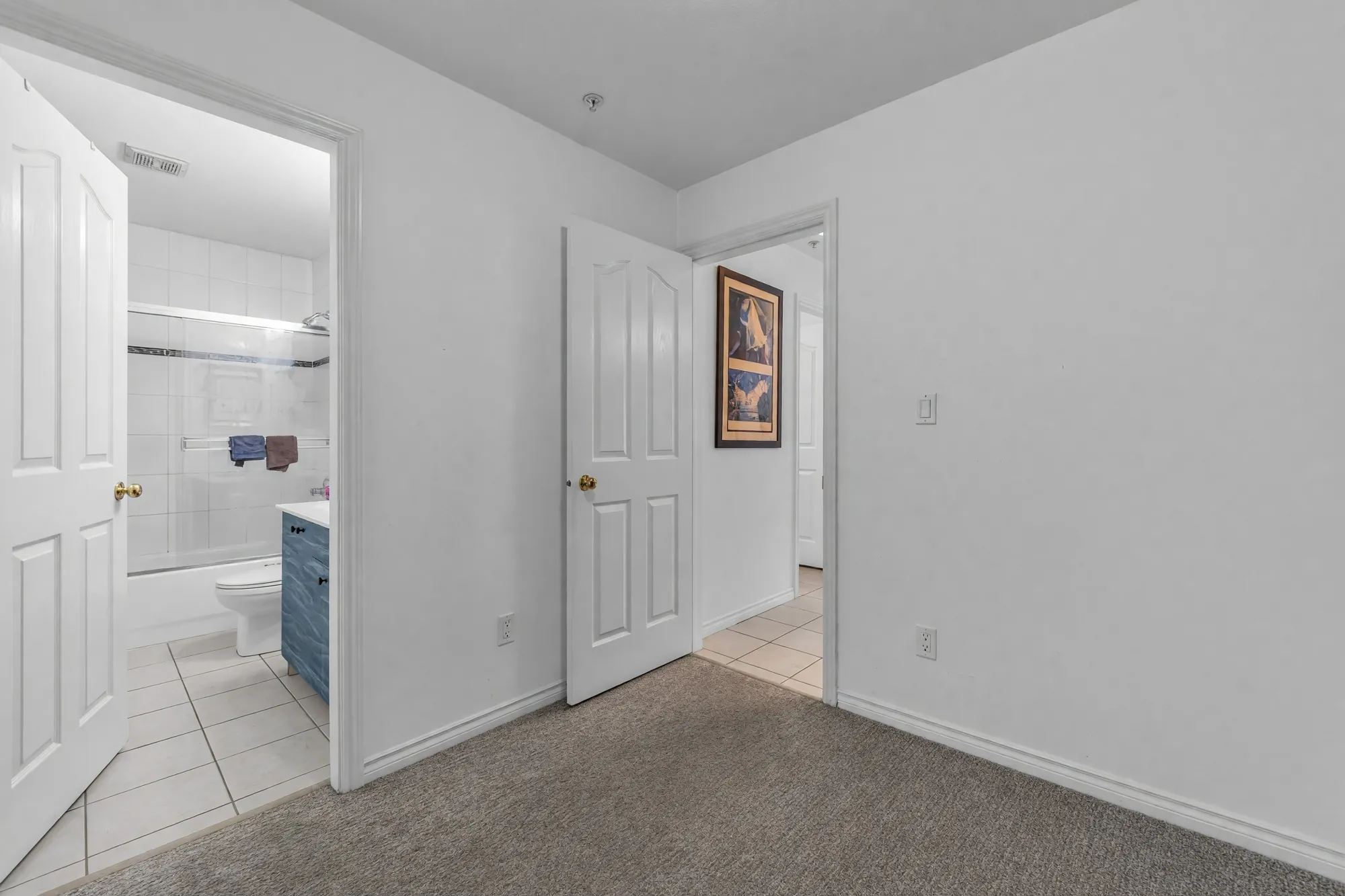 The main-floor hall outside the bathroom, photographed after clutter was digitally removed
