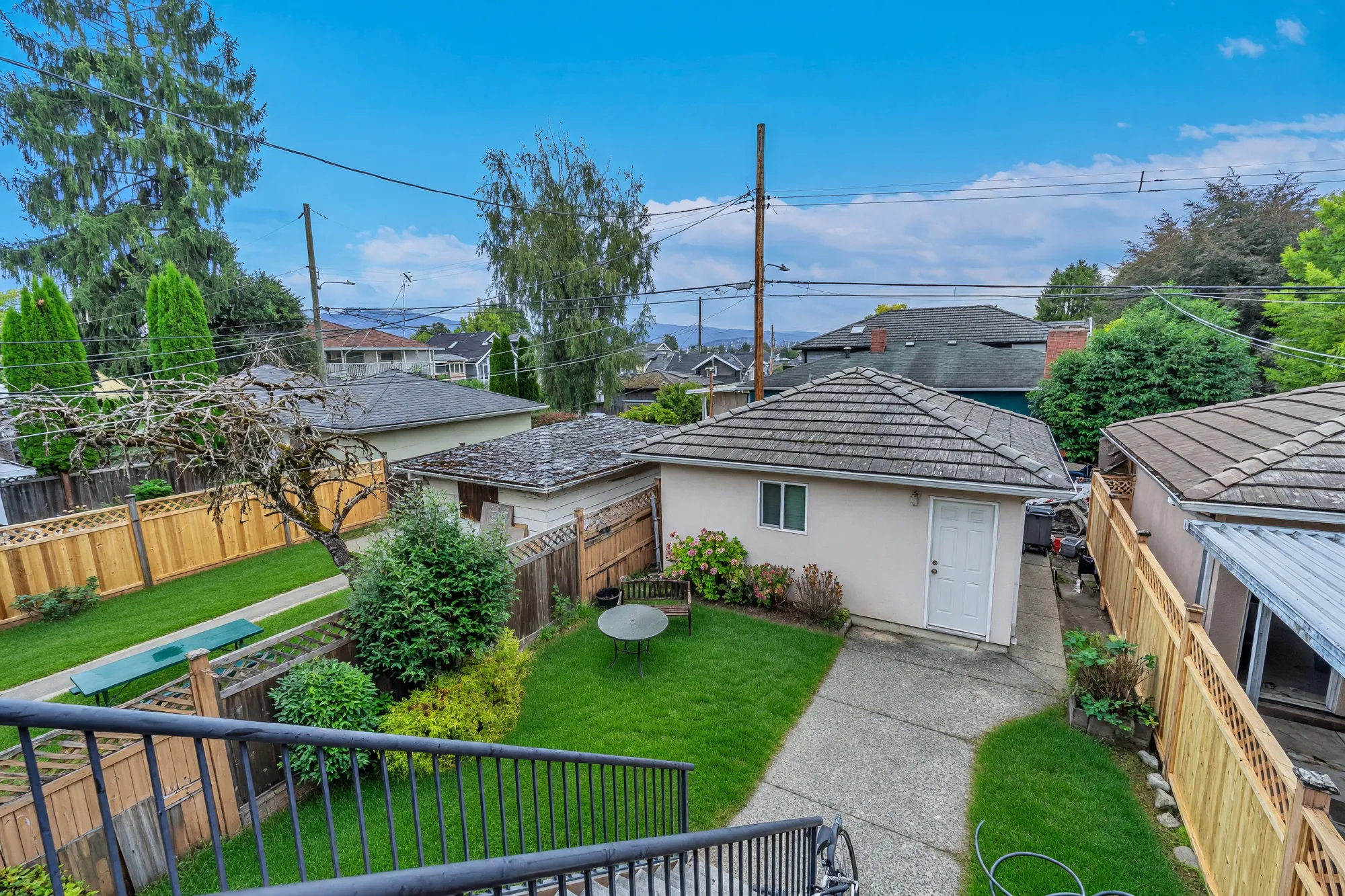 The back yard from the balcony looking toward the neighbouring roofs